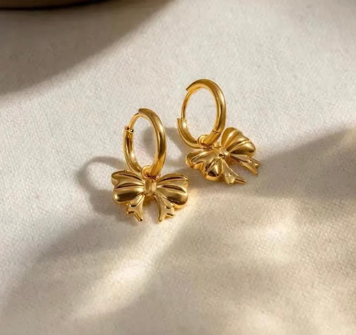 Gold earrings with cute bow